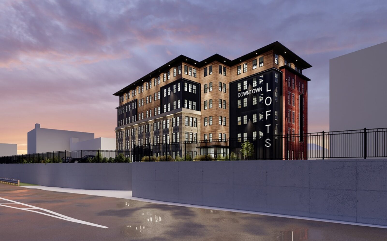 Newly designed loft building with modern architecture, featuring a mix of brick and wood elements at sunset.